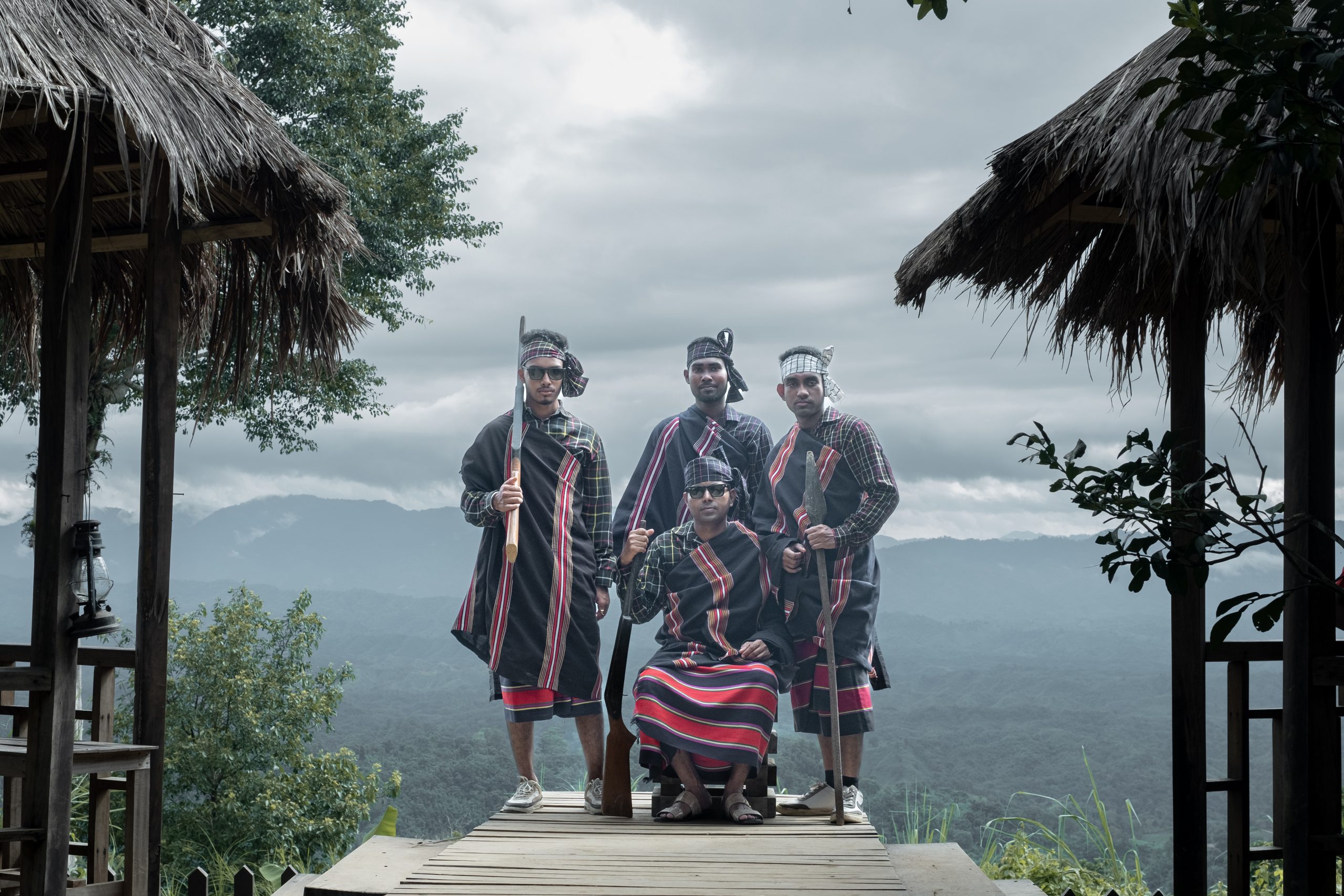 Tourists pose in wearing Lushai dress in a tourist museum in Sajek, yet the Lushai people themselves are missing, displaced by tourism.